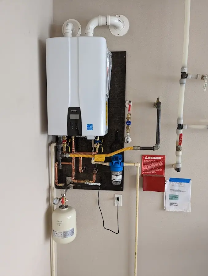 Professional plumber installing copper piping in a Chevy Chase home